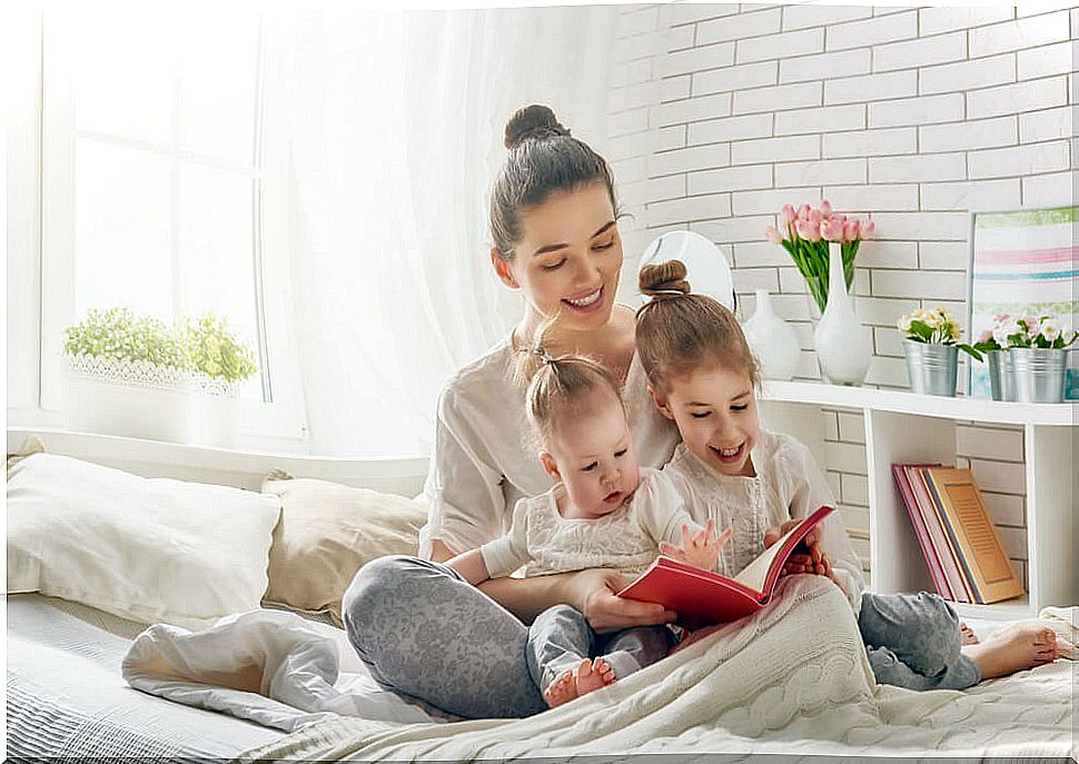 Mother reading a story to her children