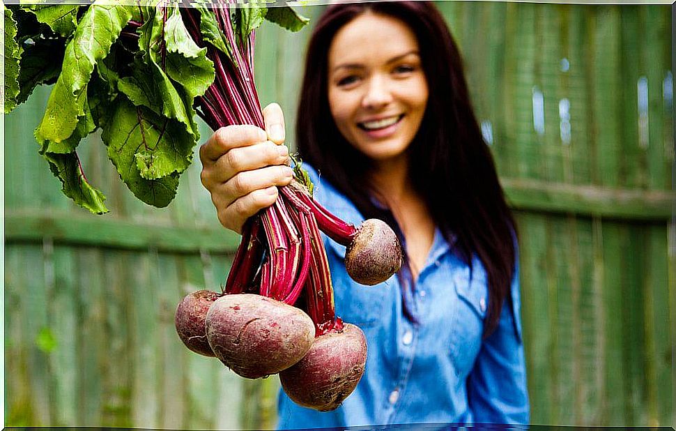Woman holding beets