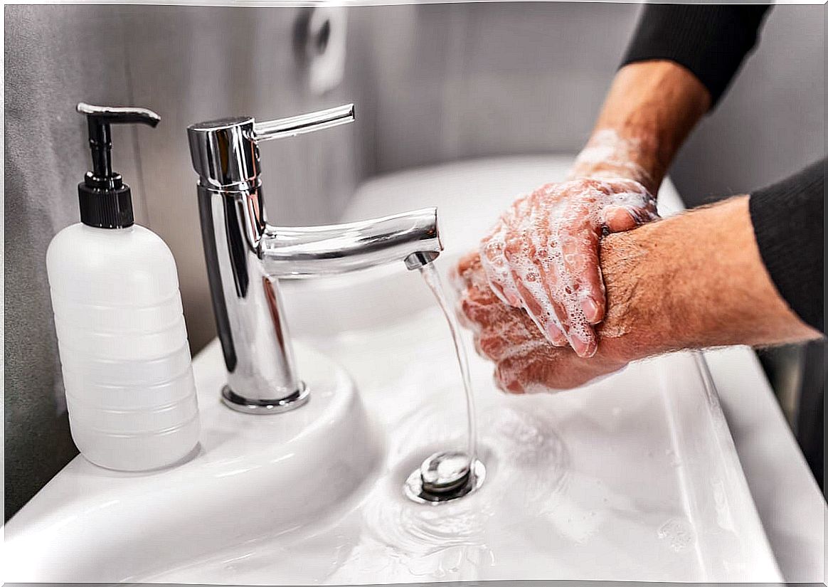 Hand washing in the sink area.