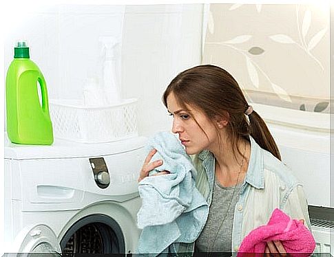 woman smelling clothes after washing